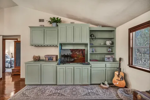 a room with a cabinets and wooden floor