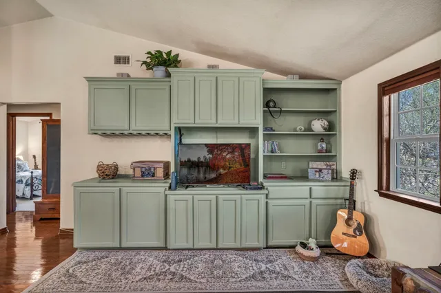 a room with a cabinets and wooden floor