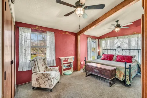 a room with furniture and a ceiling fan
