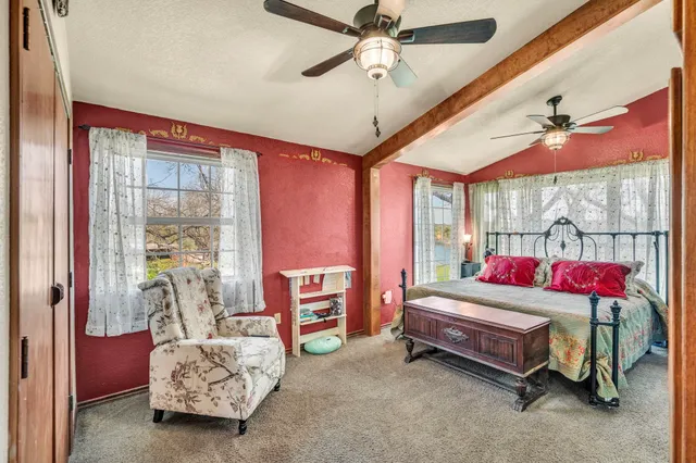 a room with furniture and a ceiling fan