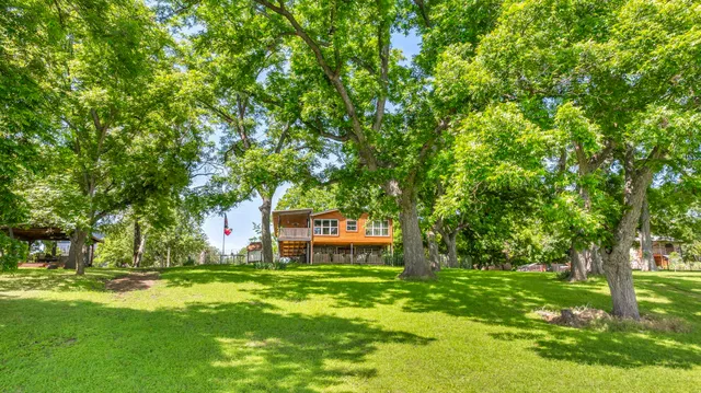 a sign that is sitting in the grass