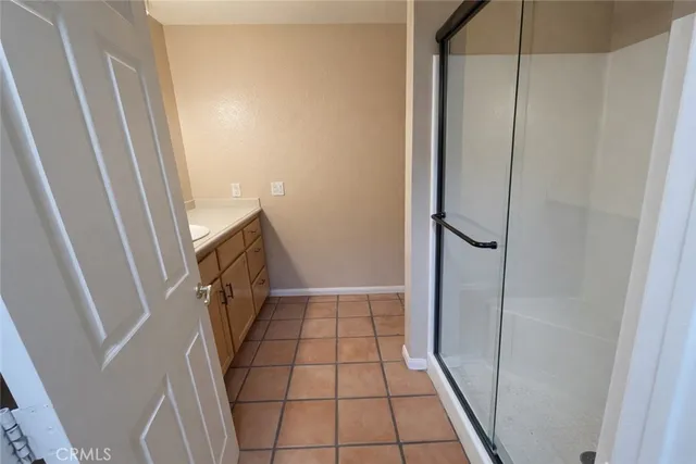 a kitchen with a sink a stove and cabinets