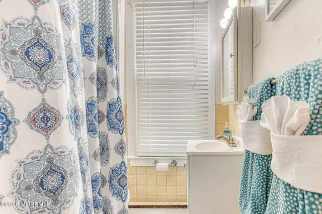 a bathroom with a bathtub and shower