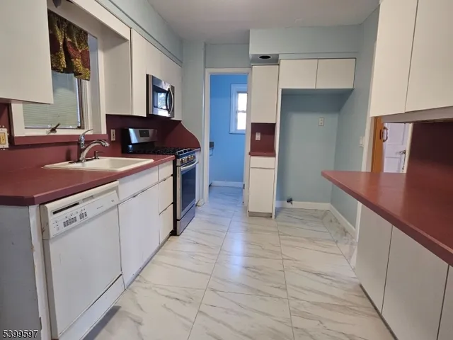 a kitchen with a sink and cabinets