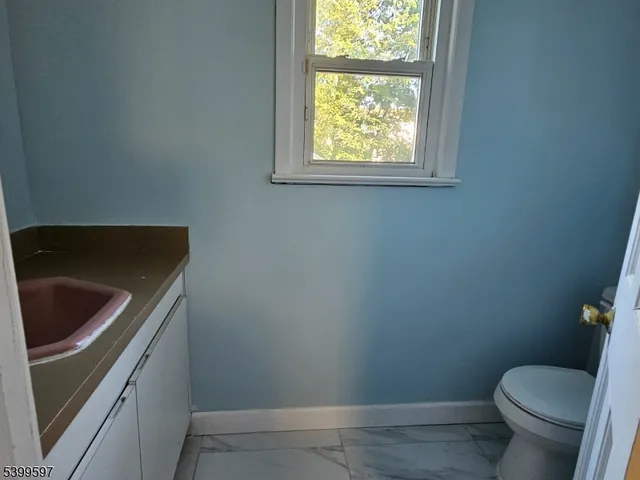 a bathroom with a sink and toilet