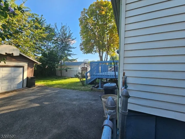 a view of a house with a yard and garage