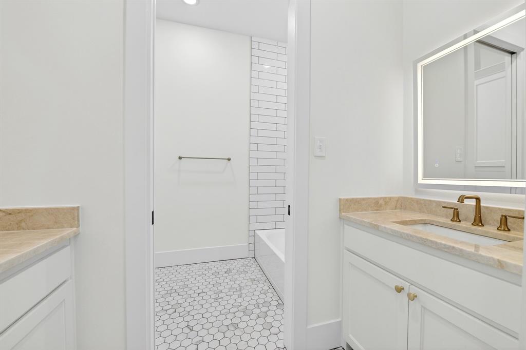 10373 Bobbie Lane Pilot Point, TX 76258 - Photo 23 of 40 One of bathrooms located downstairs with 2 separate sink areas