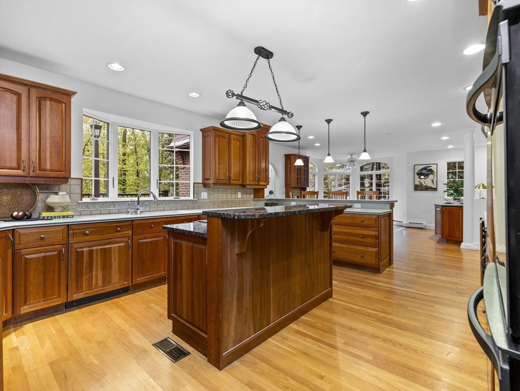 37 Hillside Road Wellesley, MA 02481 - Photo 11 of 37 a kitchen with stainless steel appliances granite countertop a sink a stove and a wooden floors