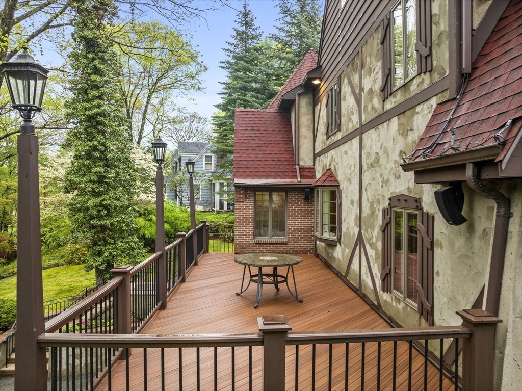 37 Hillside Road Wellesley, MA 02481 - Photo 33 of 37 a balcony of a house with wooden floor and outdoor seating