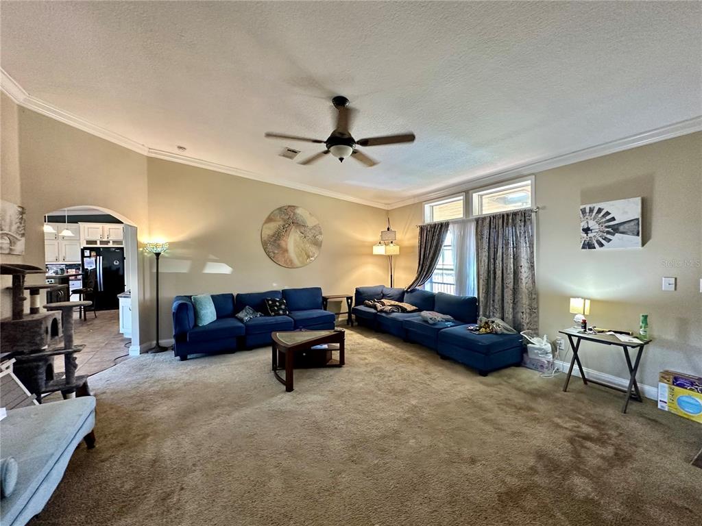 237 Southwest Baron Glen Fort White, FL 32038 - Photo 13 of 30 a living room with furniture and a chandelier