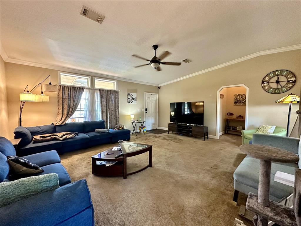 237 Southwest Baron Glen Fort White, FL 32038 - Photo 15 of 30 a living room with furniture and a flat screen tv