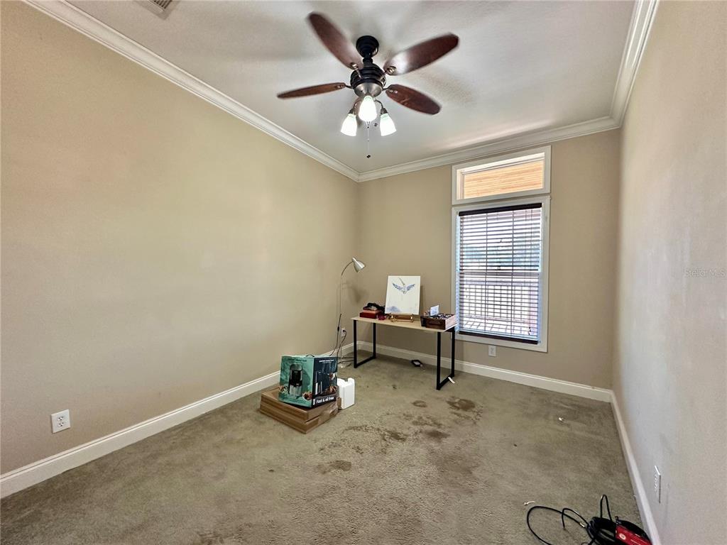 237 Southwest Baron Glen Fort White, FL 32038 - Photo 21 of 30 an empty room with chandelier fan and windows