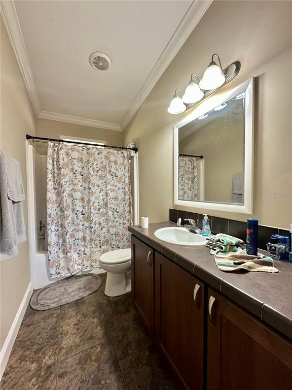 237 Southwest Baron Glen Fort White, FL 32038 - Photo 22 of 30 a bathroom with a double vanity sink toilet and a mirror