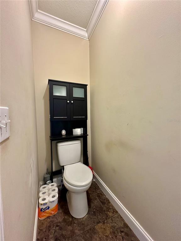 237 Southwest Baron Glen Fort White, FL 32038 - Photo 24 of 30 a white toilet sitting next to a white sink and vanity