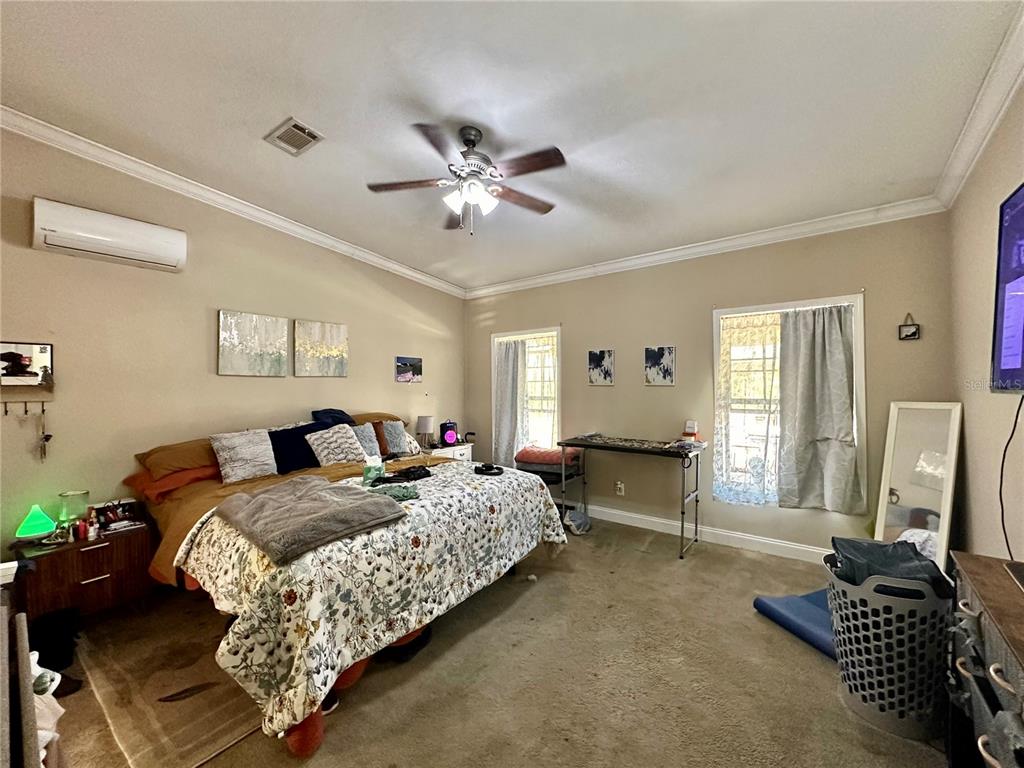 237 Southwest Baron Glen Fort White, FL 32038 - Photo 27 of 30 a bedroom with a bed and furniture