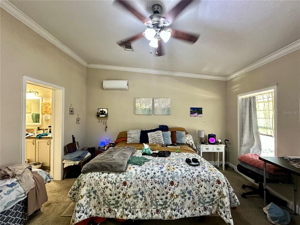 237 Southwest Baron Glen Fort White, FL 32038 - Photo 28 of 30 a bedroom with a bed and a window