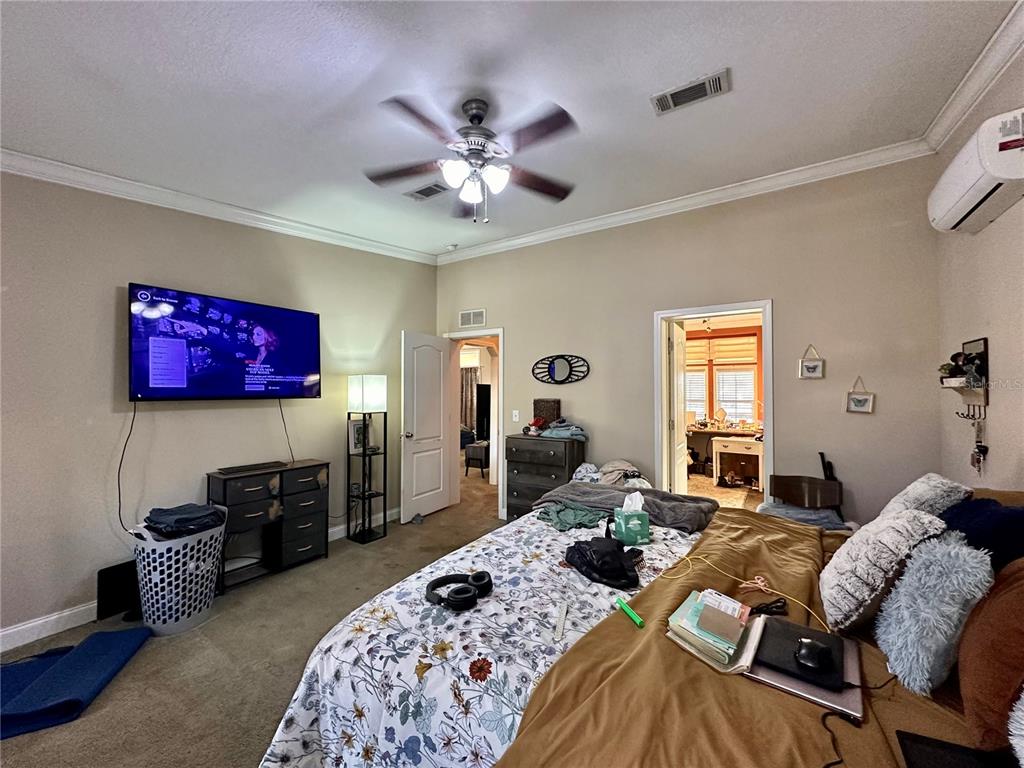 237 Southwest Baron Glen Fort White, FL 32038 - Photo 29 of 30 a bed room with furniture and a flat screen tv