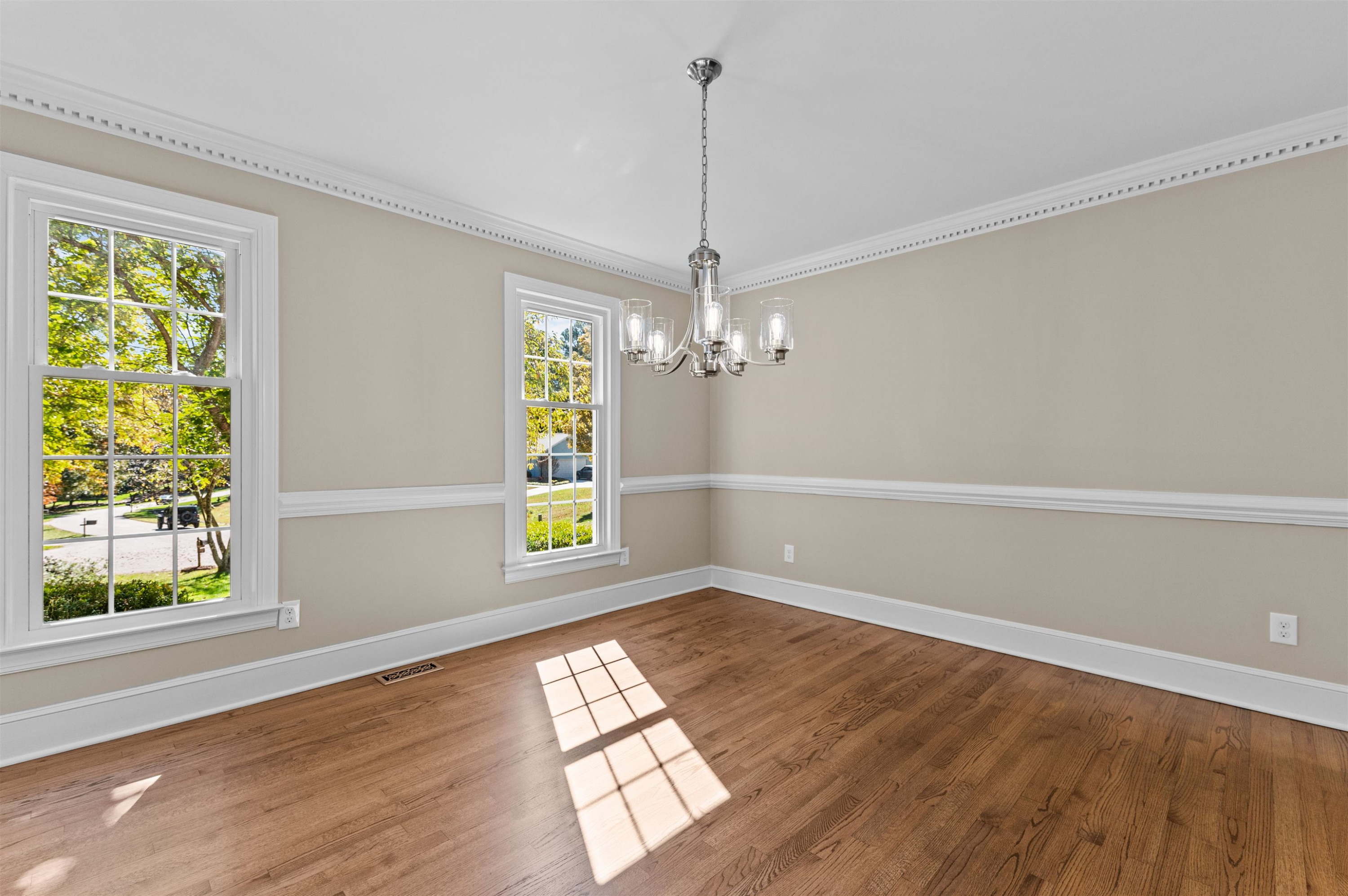 3000 Daventry Lane Raleigh, NC 27613 - Photo 16 of 54 a view of empty room with wooden floor and fan