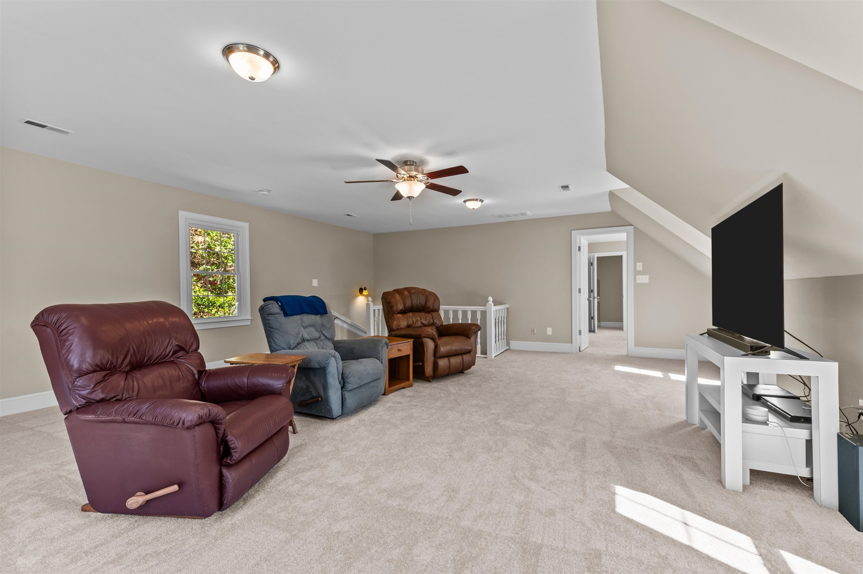 3000 Daventry Lane Raleigh, NC 27613 - Photo 30 of 54 a living room with furniture and a flat screen tv