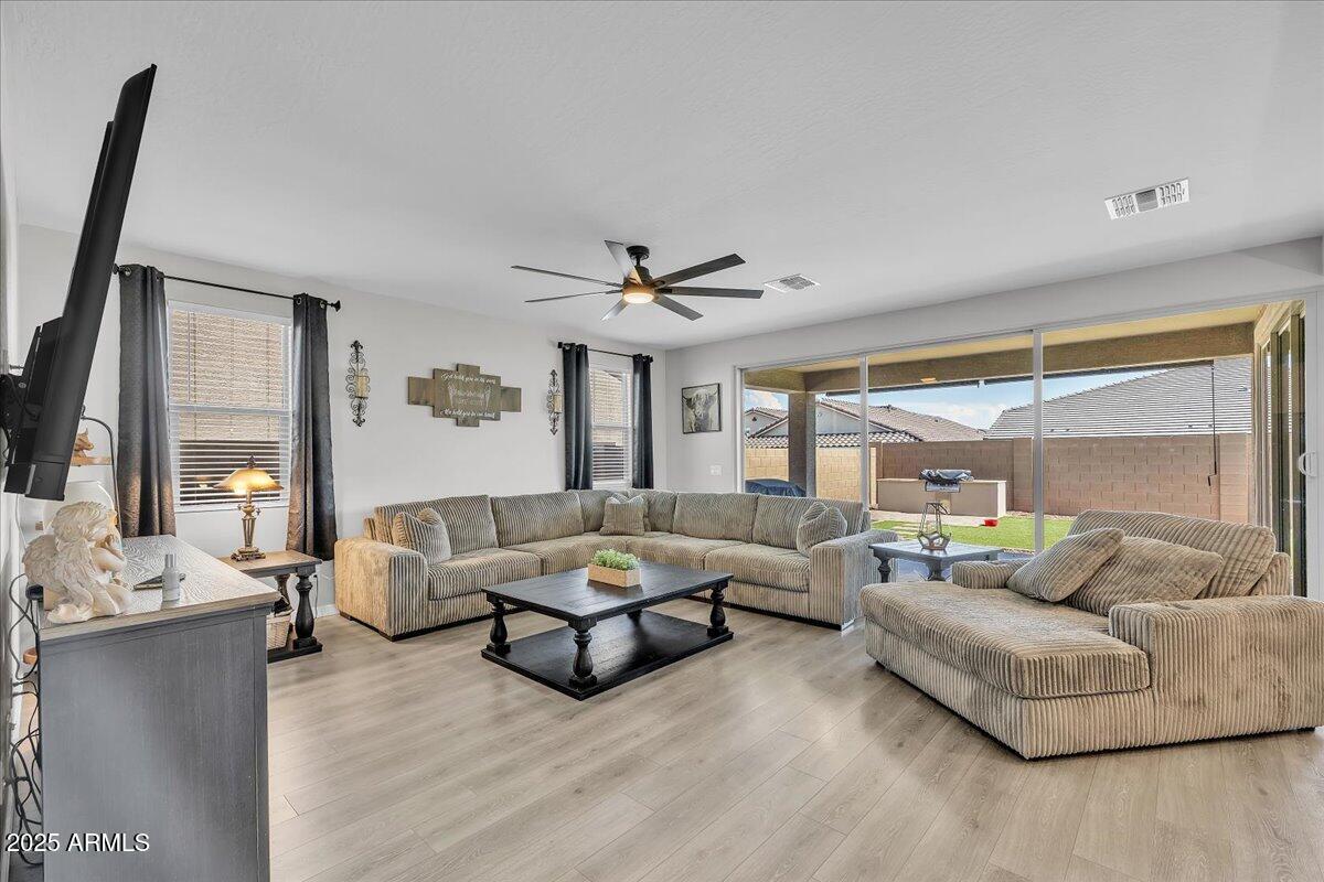 17593 West Red Fox Road Surprise, AZ 85387 - Photo 17 of 55 a living room with furniture and a large window