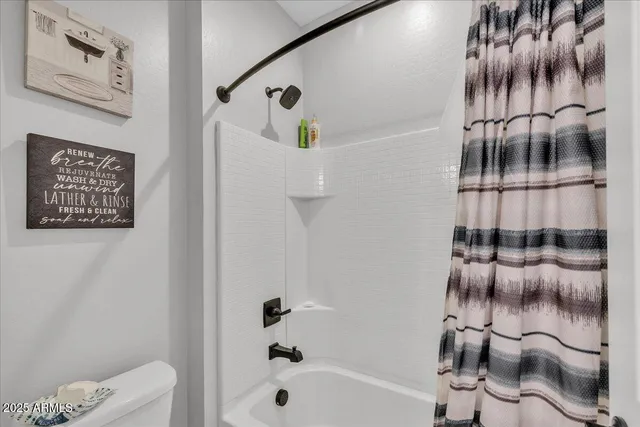 a utility room with washer and dryer