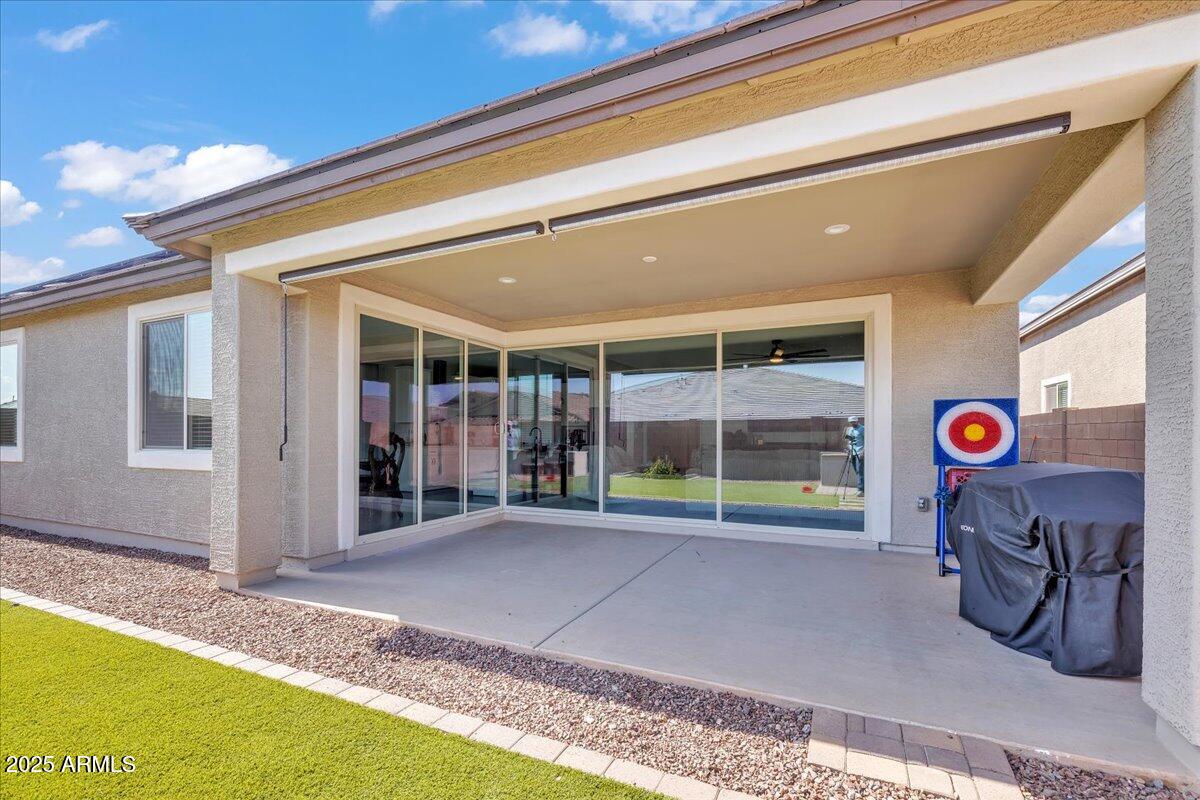 17593 West Red Fox Road Surprise, AZ 85387 - Photo 37 of 55 a view of a house with a backyard porch and sitting area