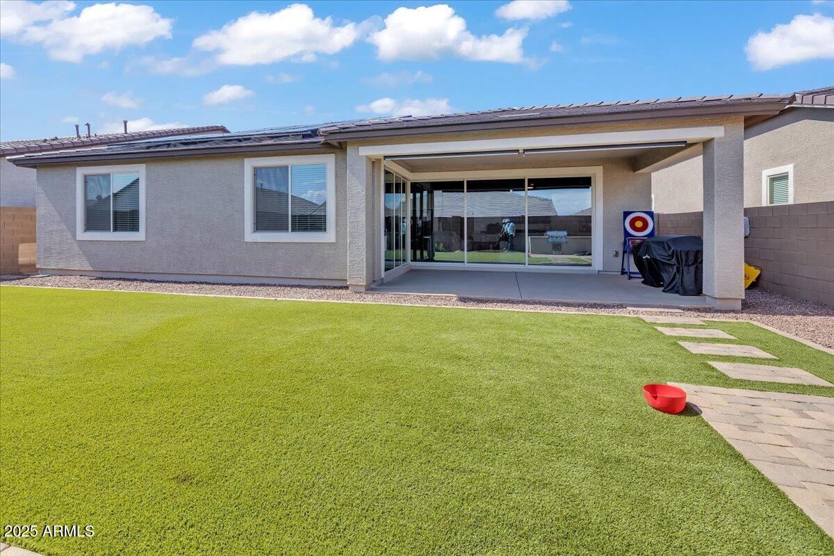 17593 West Red Fox Road Surprise, AZ 85387 - Photo 40 of 55 a view of a house with swimming pool and porch
