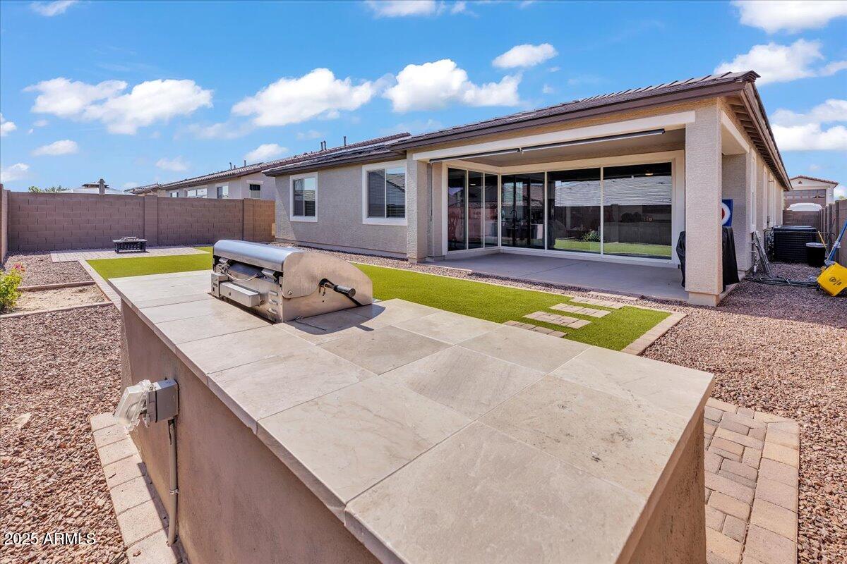 17593 West Red Fox Road Surprise, AZ 85387 - Photo 41 of 55 a view of a house with swimming pool and sitting area