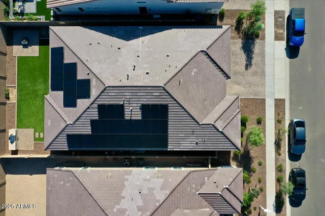 an aerial view of a house with a garden