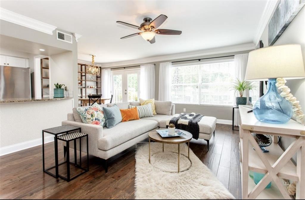 6980 Roswell Road, Unit B6 Atlanta, GA 30328 - Photo 1 of 30 a living room with furniture a table and a large window