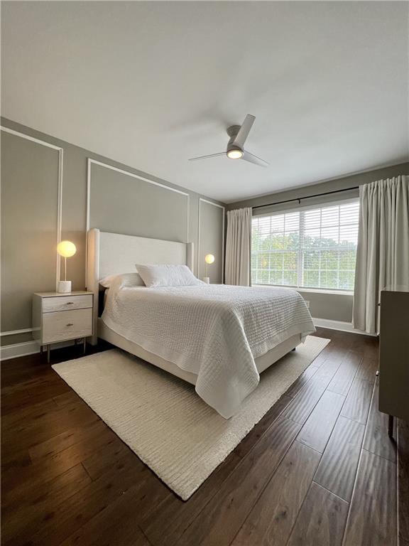 6980 Roswell Road, Unit B6 Atlanta, GA 30328 - Photo 15 of 30 a bedroom with a large bed and a large window