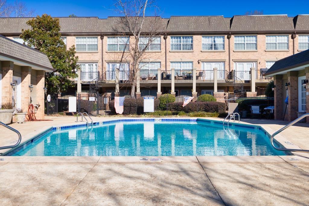 6980 Roswell Road, Unit B6 Atlanta, GA 30328 - Photo 28 of 30 a view of a house with a swimming pool