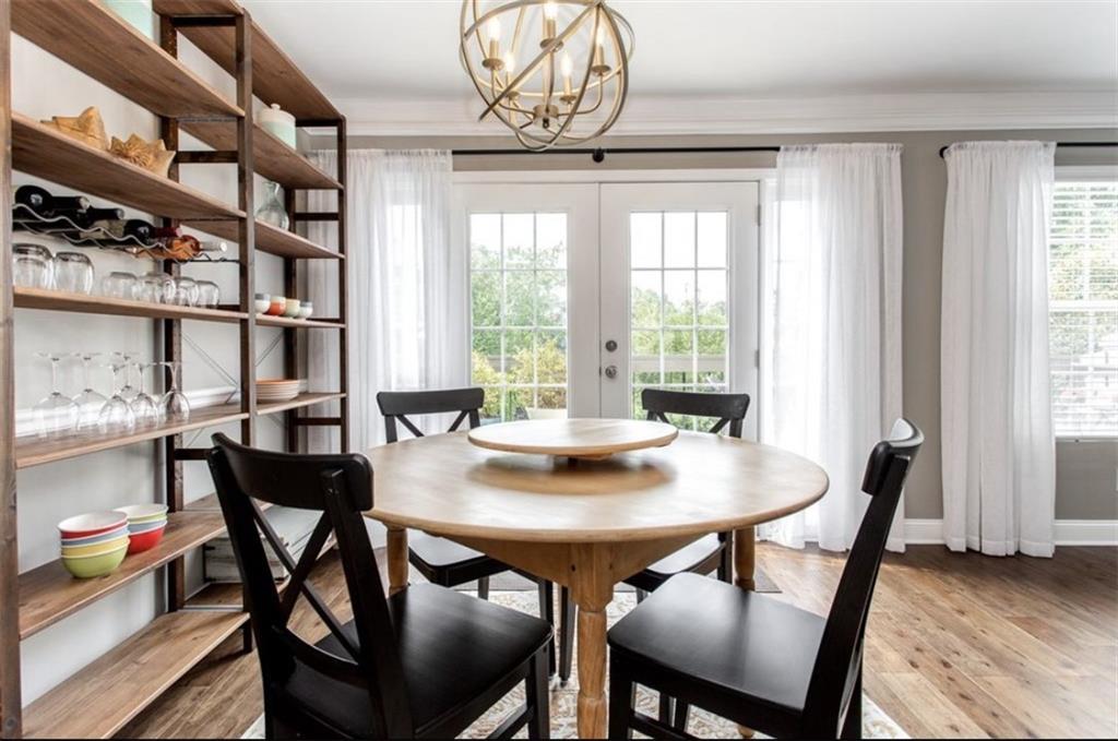 6980 Roswell Road, Unit B6 Atlanta, GA 30328 - Photo 10 of 30 a view of a dining room with furniture and a window