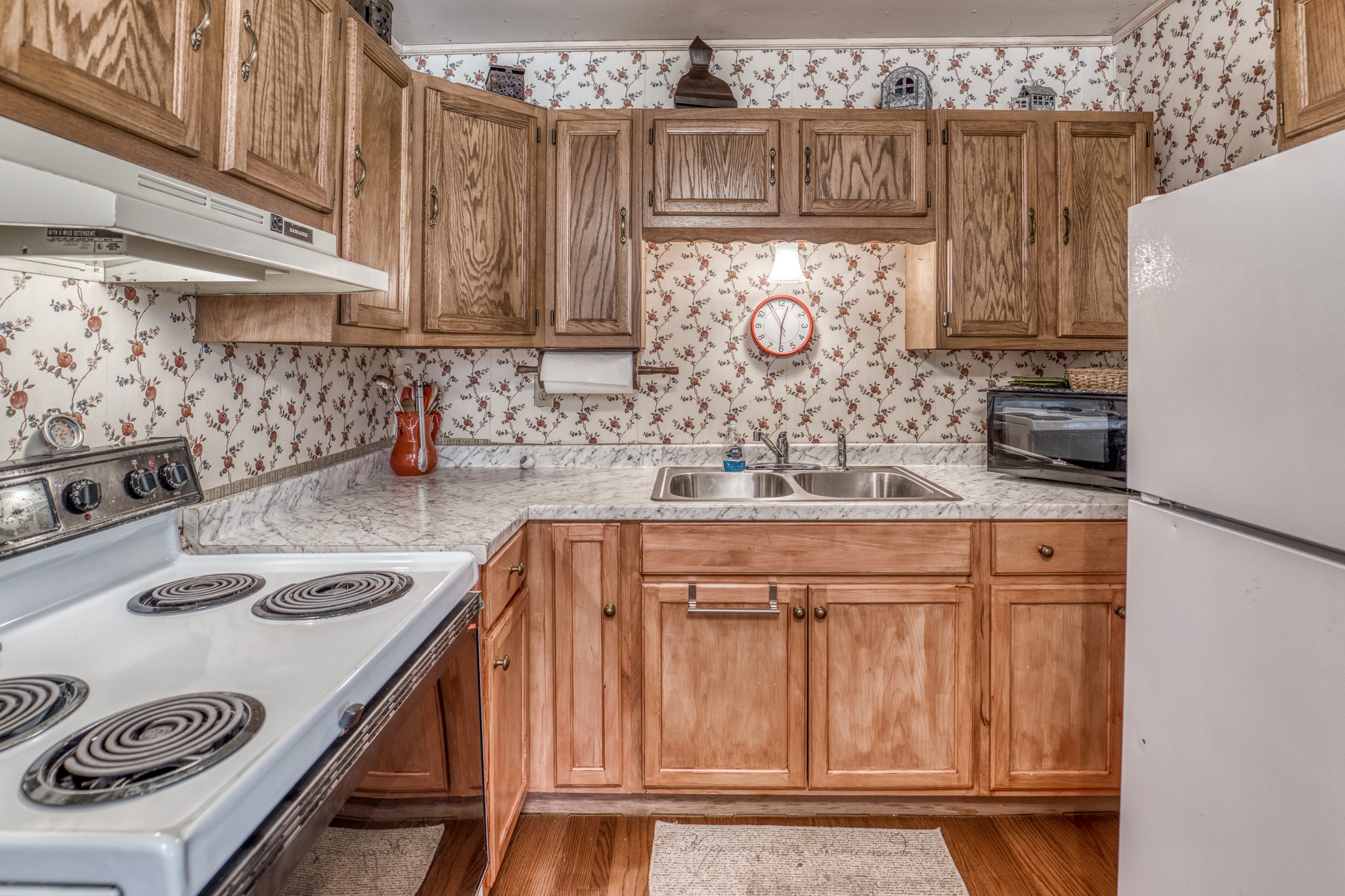 1017 Allen Road Cat Spring, TX 78933 - Photo 34 of 47 a kitchen with granite countertop a sink a stove and a refrigerator