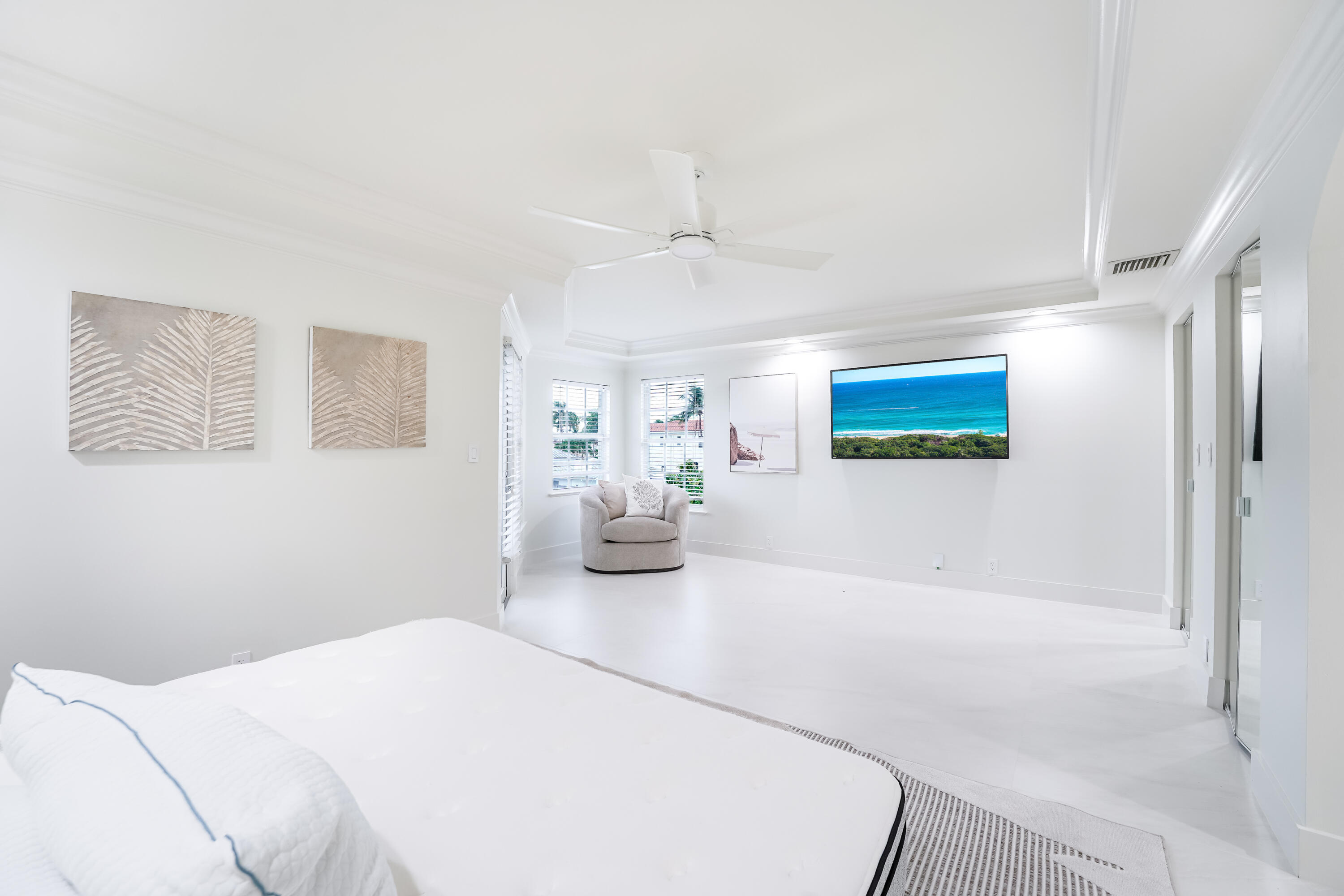 749 Northeast 71st Street Boca Raton, FL 33487 - Photo 39 of 43 a bedroom with a bed and a chandelier