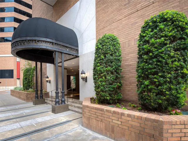 a view of a house with potted plants