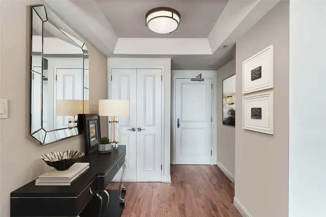 a view of living room with furniture and wooden floor