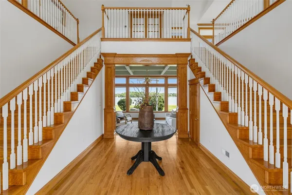 a view of entryway with wooden floor and a rug