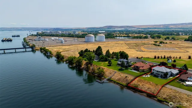an aerial view of a city and lake view