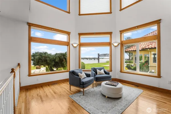 a living room with furniture a ceiling fan and a window
