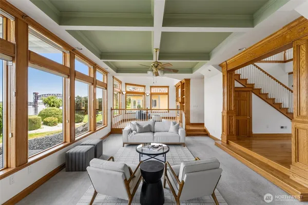 a kitchen with stainless steel appliances granite countertop a refrigerator a sink and a stove with wooden floor