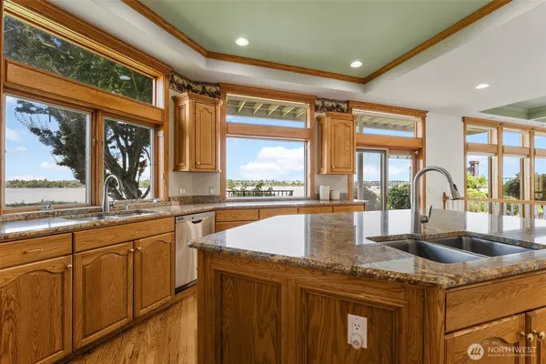 a dining room with furniture and wooden floor