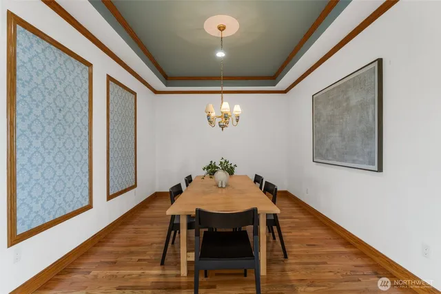 a room with furniture a window and stainless steel appliances