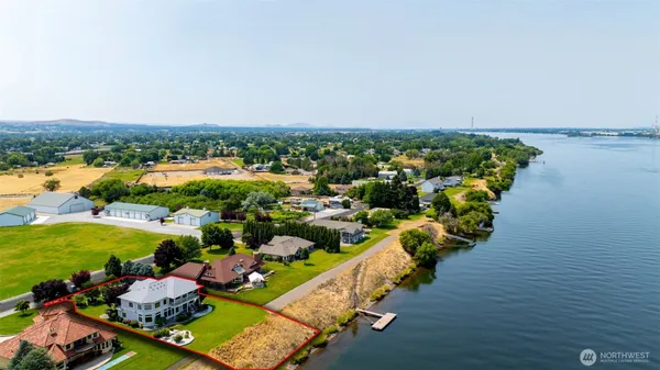 an aerial view of a house with a lake view
