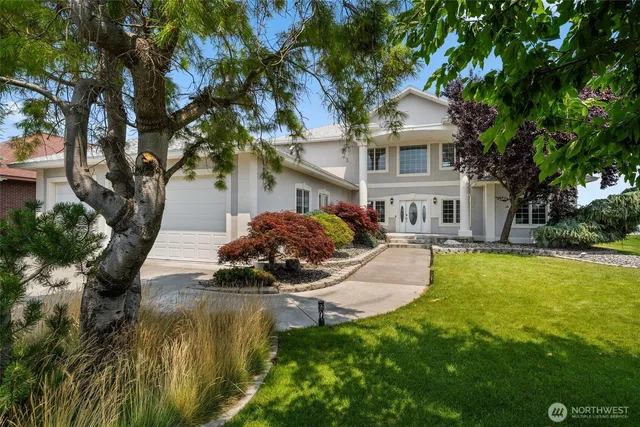 a front view of a house with swimming pool having outdoor seating