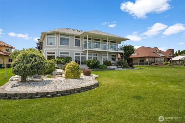a view of an ocean with a building in the background