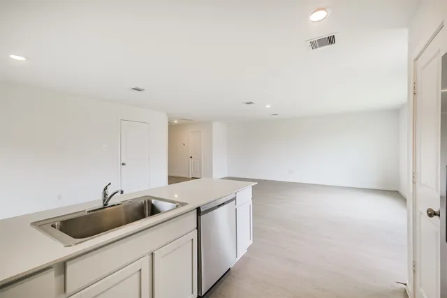 a kitchen with a sink and cabinets