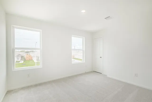 an empty room with windows