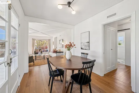 a kitchen with granite countertop a sink a window and cabinets