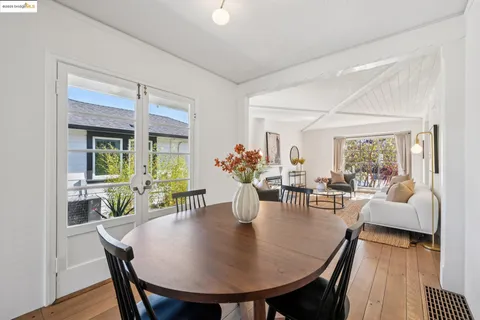 a kitchen with granite countertop stainless steel appliances a refrigerator sink and cabinets